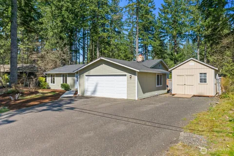 a view of house with garage and