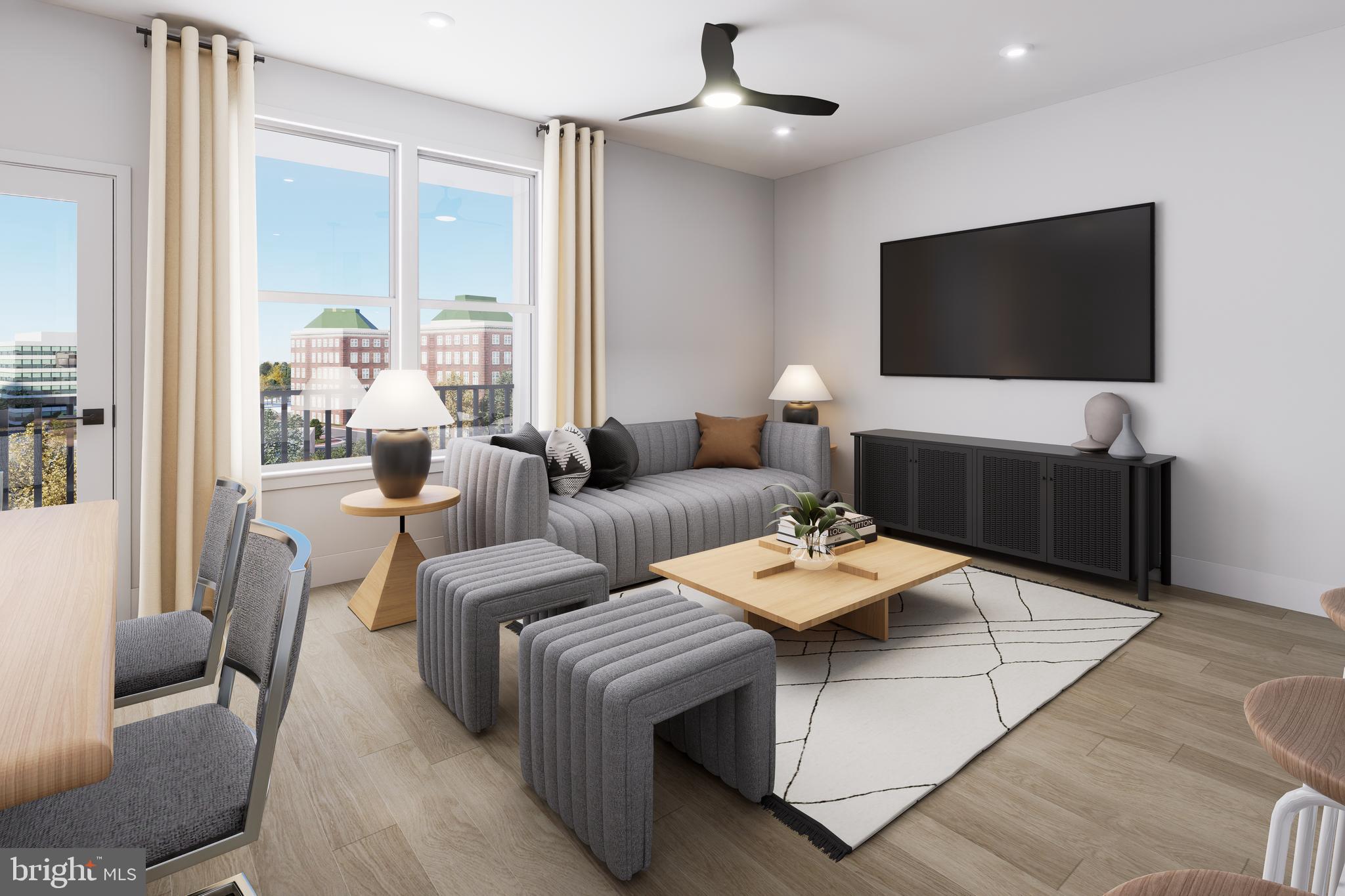 1121 Fortune Terrace, Unit 302 Potomac, MD 20854 - Photo 5 of 10 a living room with furniture and a flat screen tv