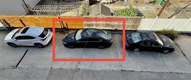 a car parked in front of a building