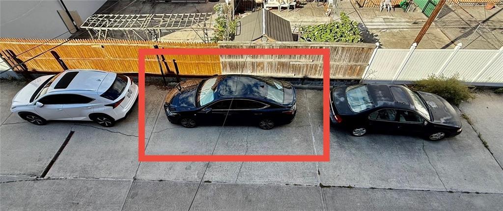 8752 18th Avenue, Unit 3E Brooklyn, NY 11214 - Photo 11 of 15 a car parked in front of a building