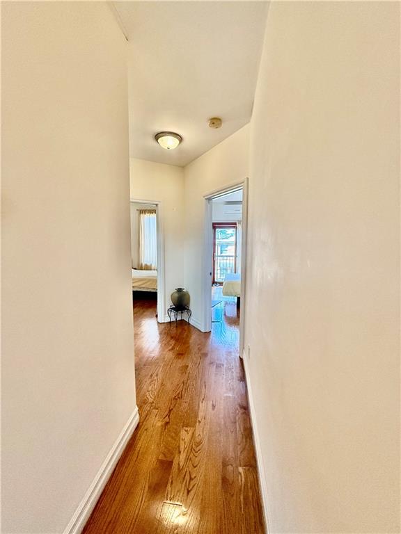 8752 18th Avenue, Unit 3E Brooklyn, NY 11214 - Photo 13 of 15 a bathroom with a sink and a mirror