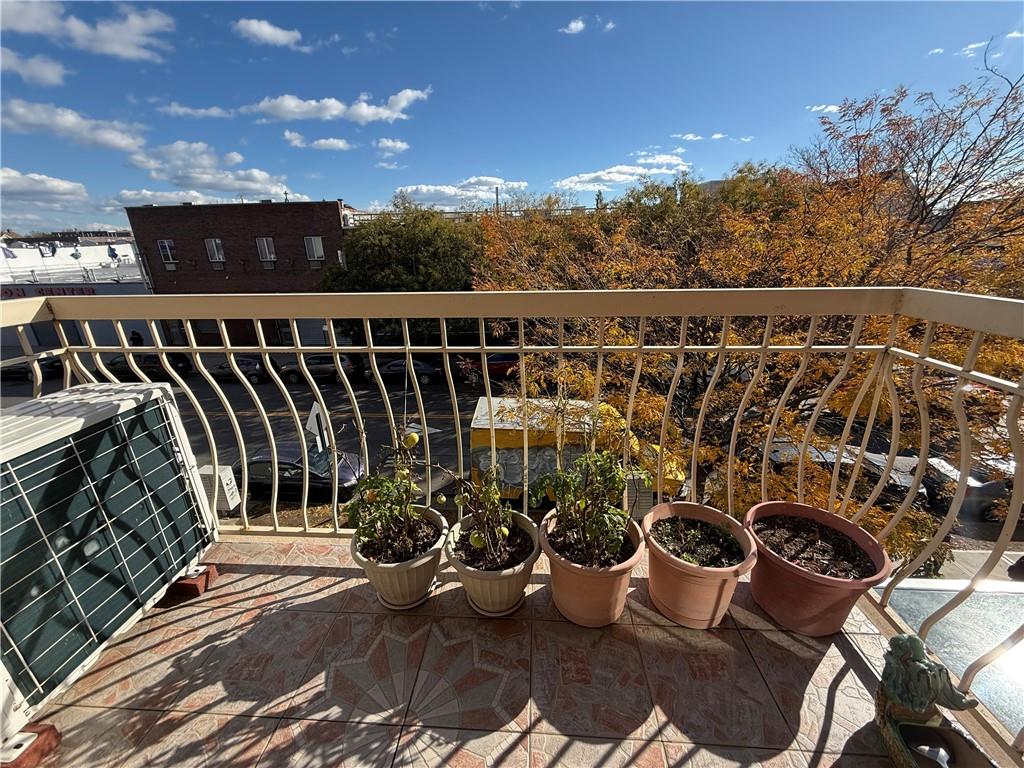 8752 18th Avenue, Unit 3E Brooklyn, NY 11214 - Photo 6 of 15 a view of a balcony with chairs and potted plants