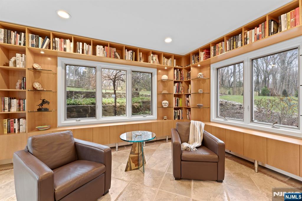 67 Forest Road Tenafly, NJ 07670 - Photo 17 of 42 a living room with furniture and a large window