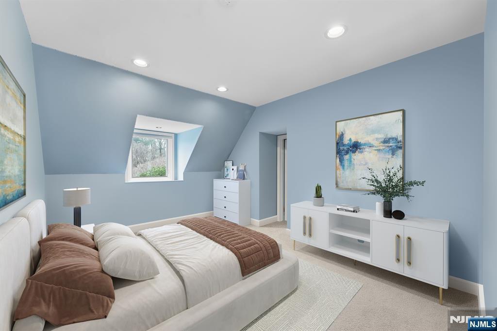 67 Forest Road Tenafly, NJ 07670 - Photo 21 of 42 a bedroom with a large bed and a couch