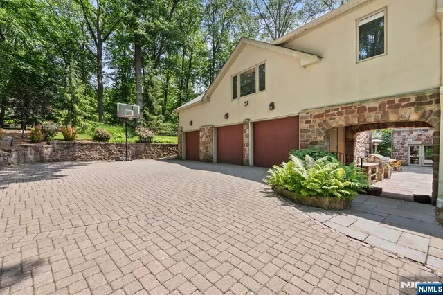 a front view of a house with a yard and a potted plants