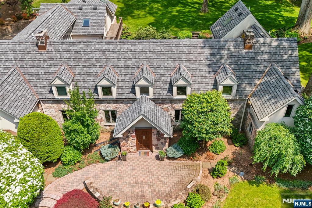 67 Forest Road Tenafly, NJ 07670 - Photo 3 of 42 aerial view of a house with a yard and potted plants