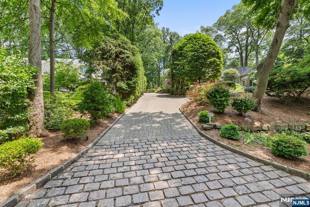 67 Forest Road Tenafly, NJ 07670 - Photo 38 of 42 a view of a pathway both side of yard