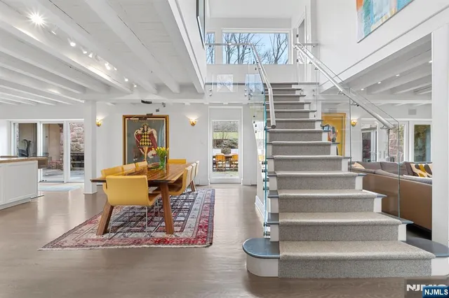 a view of entryway and hall with a dining table