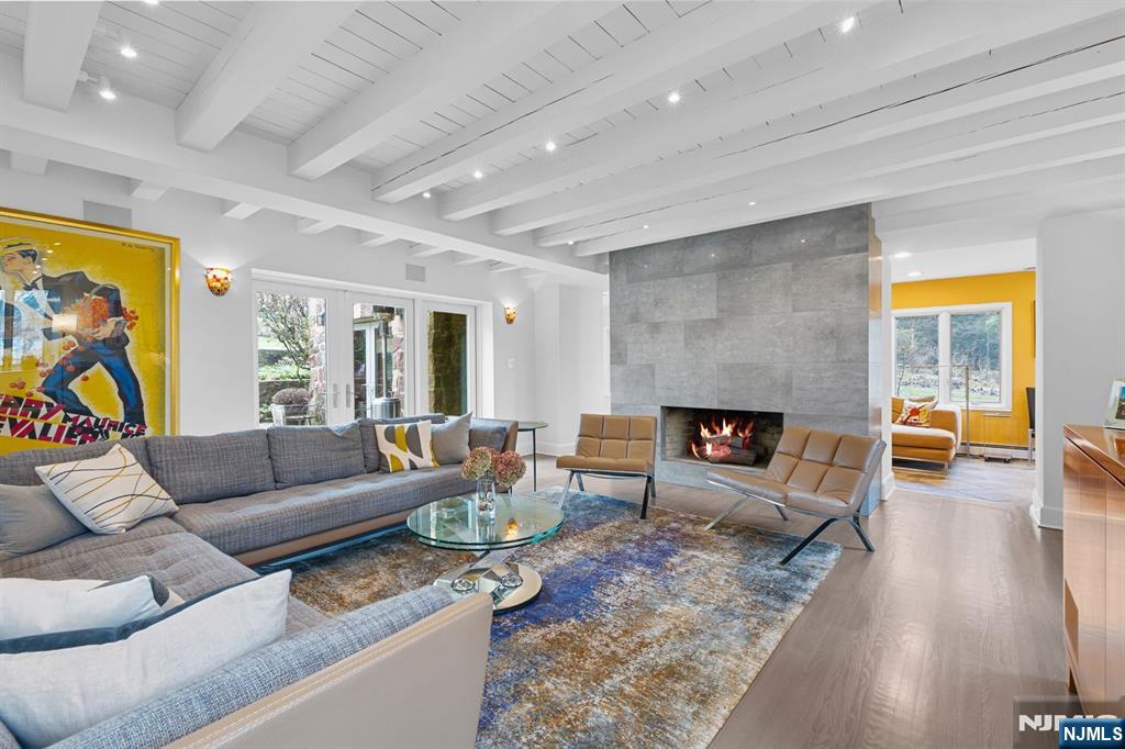 67 Forest Road Tenafly, NJ 07670 - Photo 6 of 42 a living room with furniture and a fireplace