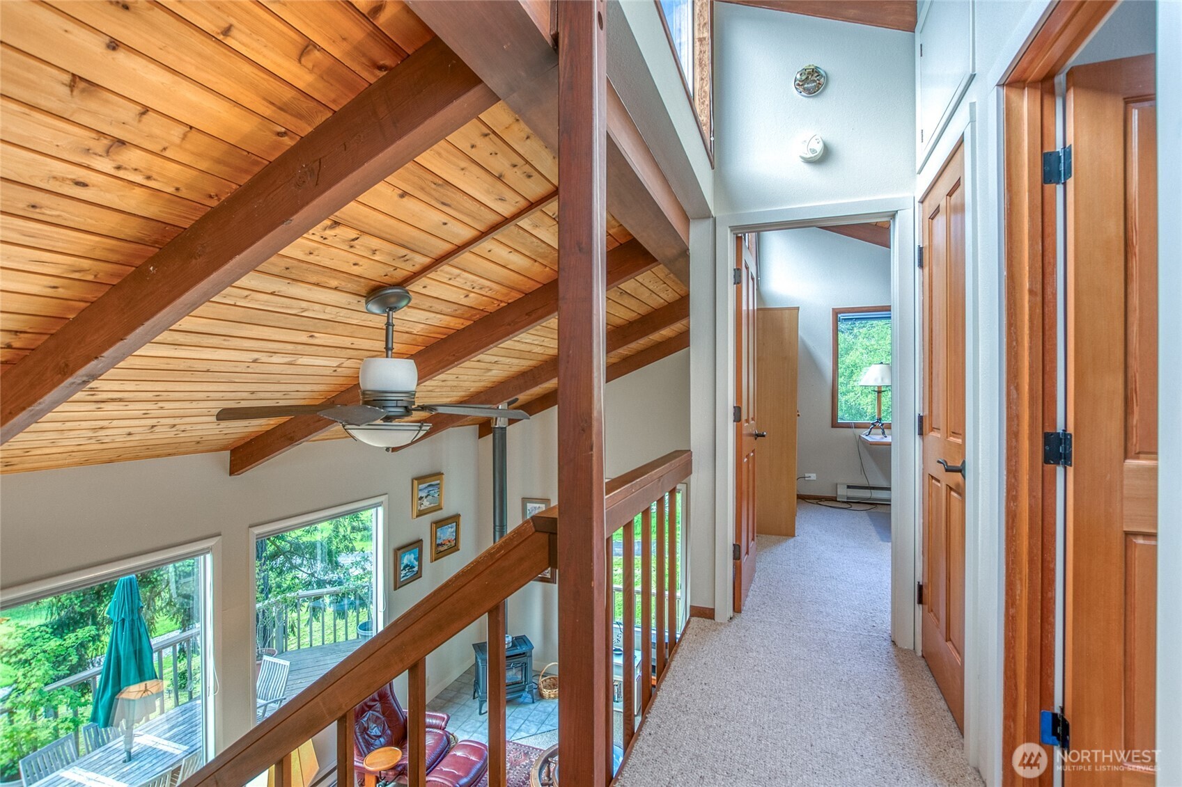 402 Cayou Valley Road Orcas Island, WA 98245 - Photo 24 of 40 a view of a hallway with wooden walls and stairs