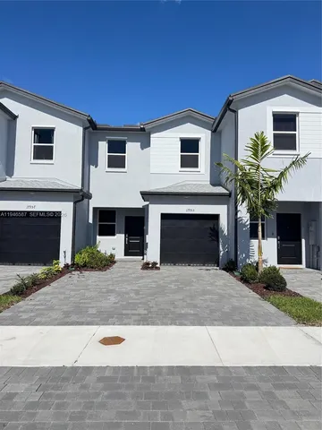a front view of a house with yard