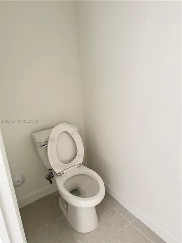 a close up of a toilet and a sink
