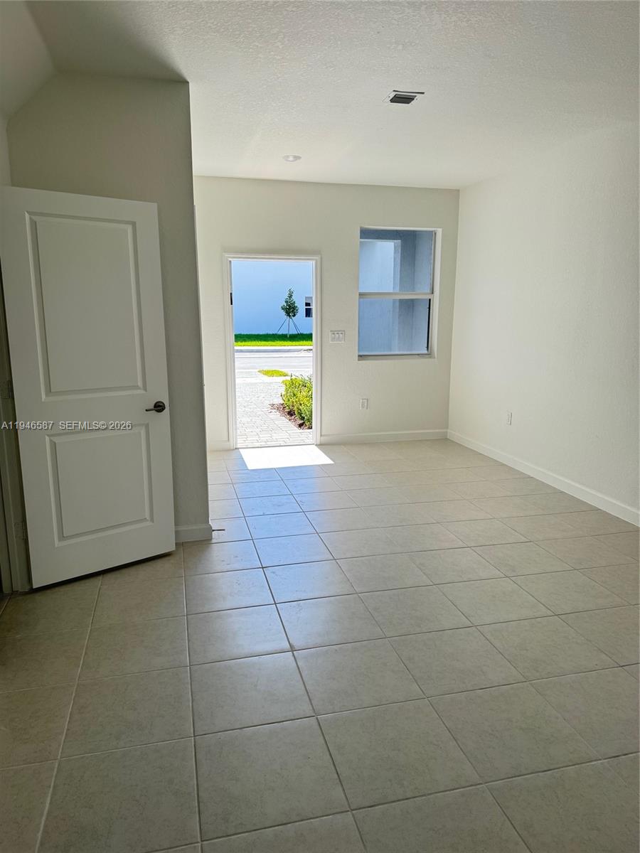 17953 Southwest 359th Street, Unit 17953 Homestead, FL 33034 - Photo 13 of 32 a view of an empty room and a window