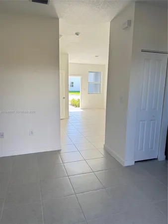 a view of a storage & utility room with a sink