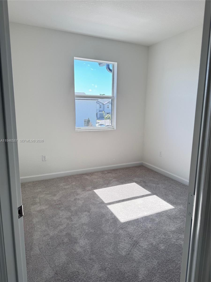 17953 Southwest 359th Street, Unit 17953 Homestead, FL 33034 - Photo 19 of 32 an empty room with a window