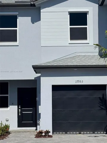 a living room with a fireplace and a flat screen tv
