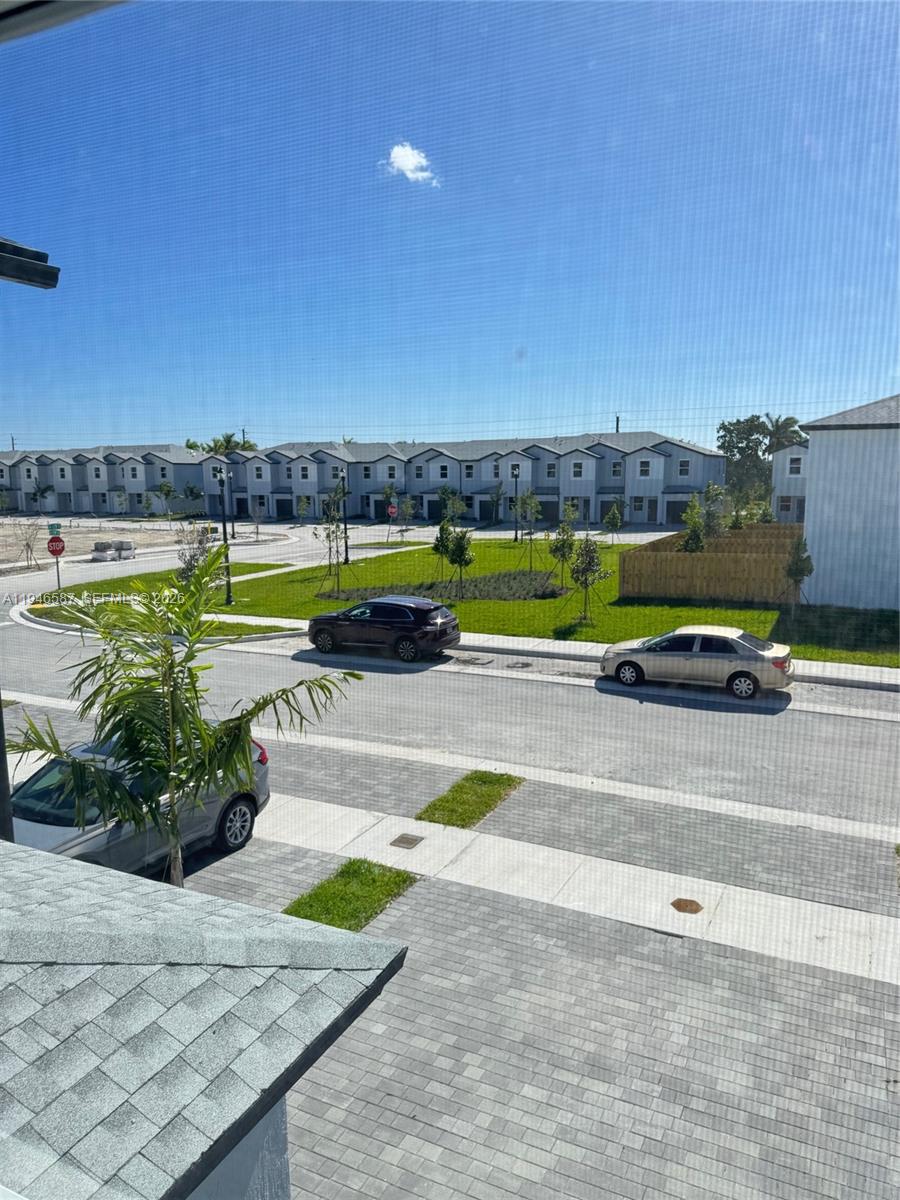 17953 Southwest 359th Street, Unit 17953 Homestead, FL 33034 - Photo 21 of 32 a view of swimming pool with outdoor seating and yard