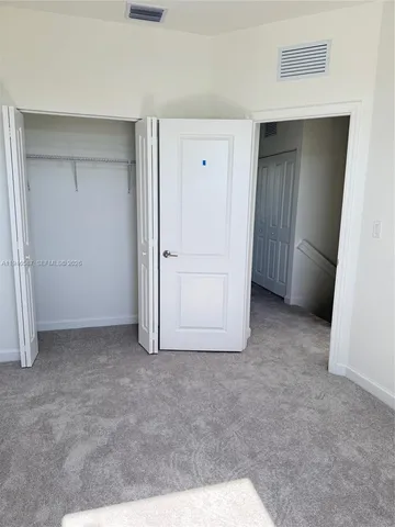 an empty room with closet