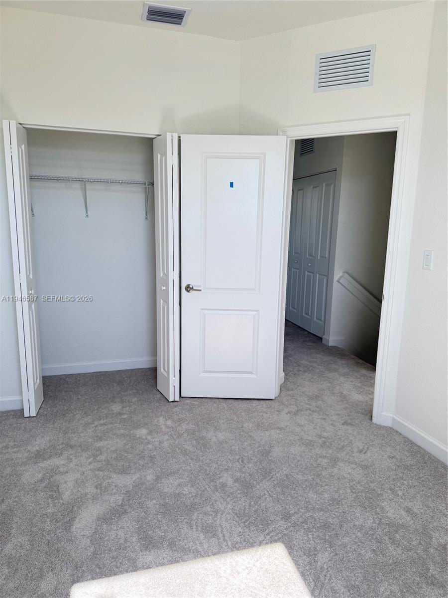 17953 Southwest 359th Street, Unit 17953 Homestead, FL 33034 - Photo 22 of 32 an empty room with closet