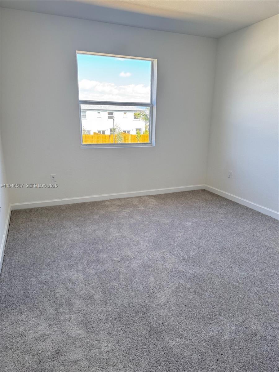 17953 Southwest 359th Street, Unit 17953 Homestead, FL 33034 - Photo 24 of 32 an empty room with a window