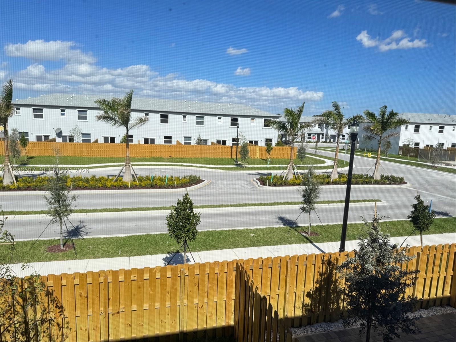 17953 Southwest 359th Street, Unit 17953 Homestead, FL 33034 - Photo 28 of 32 a view of a swimming pool and an outdoor seating