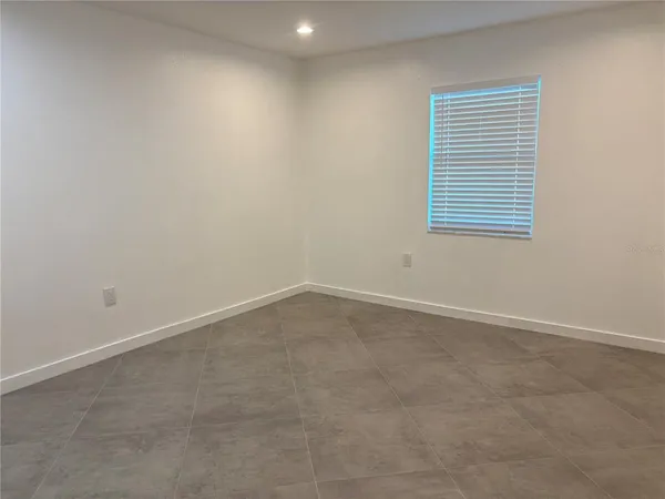 an empty room with a bathroom