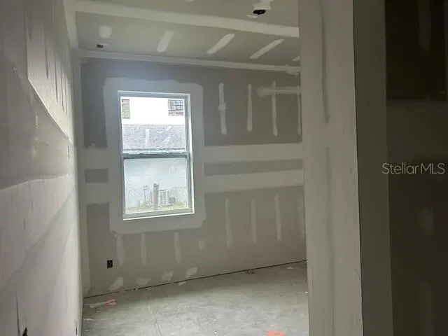 a view of an empty room with a window