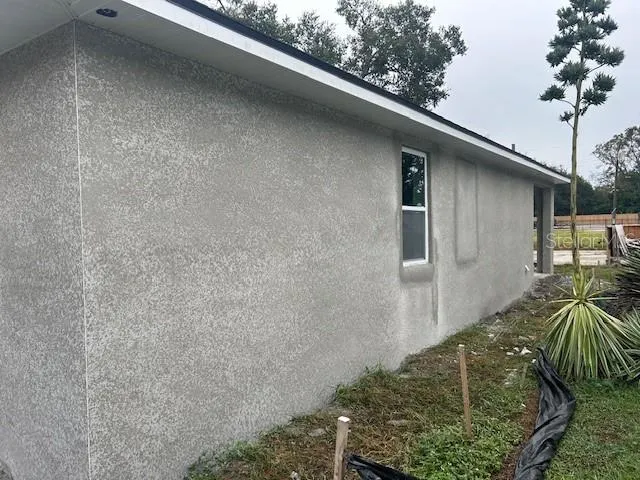 a view of backyard and porch