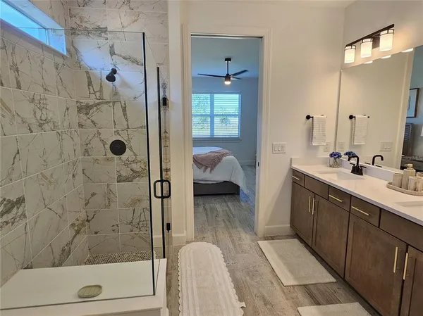 a en suite bathroom with a sink and a shower