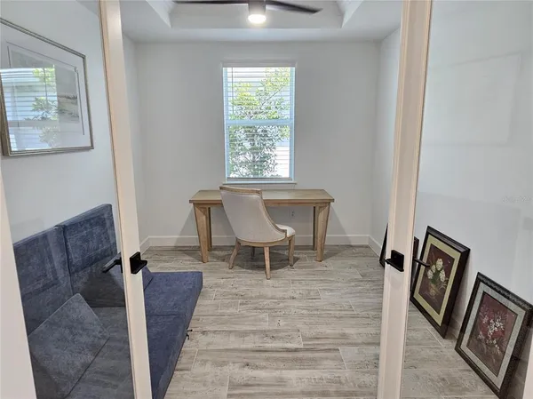 a living room with furniture and a window