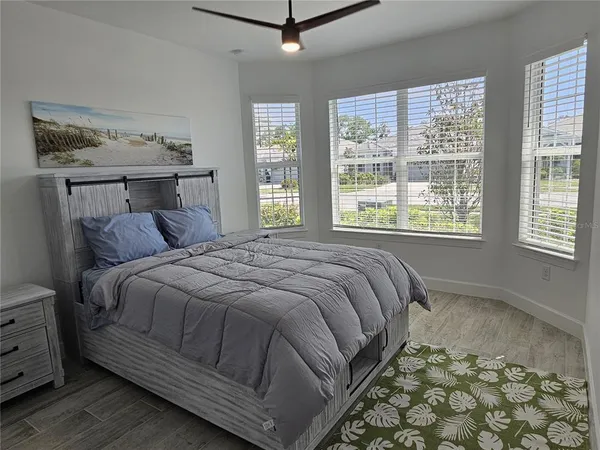 a bedroom with a bed and window