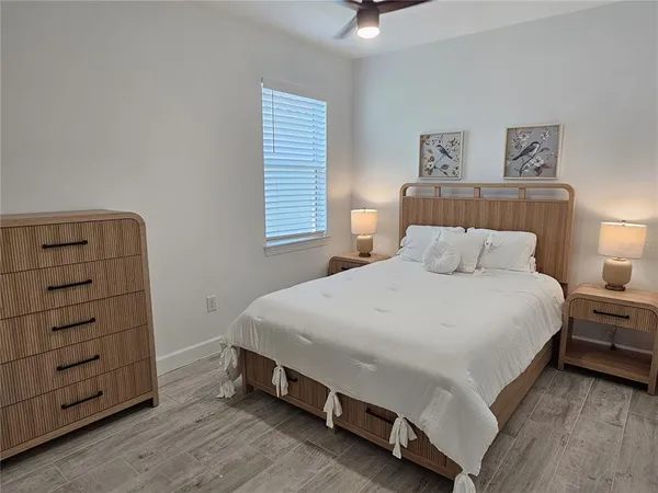 a bedroom with a bed and a dresser