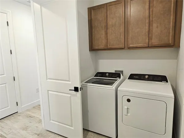 a utility room with dryer and washer
