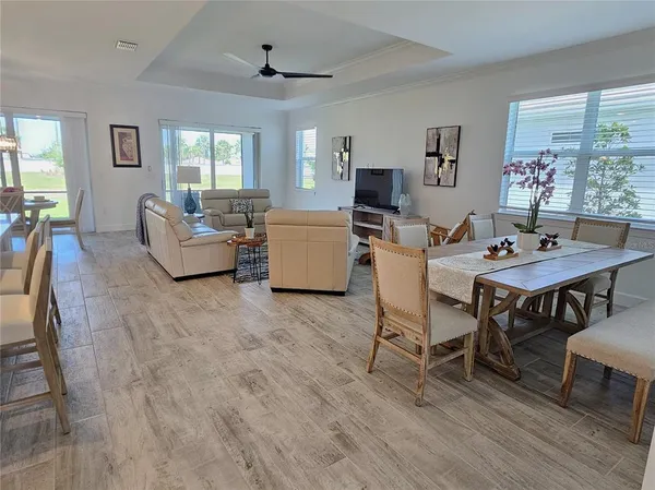 a living room with fireplace furniture and a table