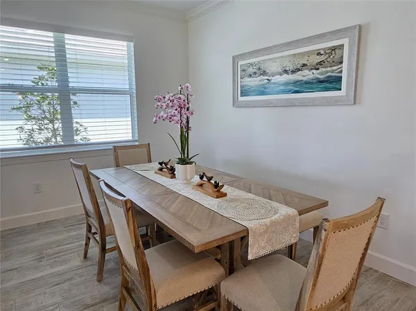 a view of a dining room with furniture and window