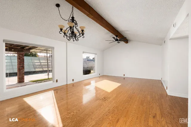 a view of a kitchen with a sink and cabinets