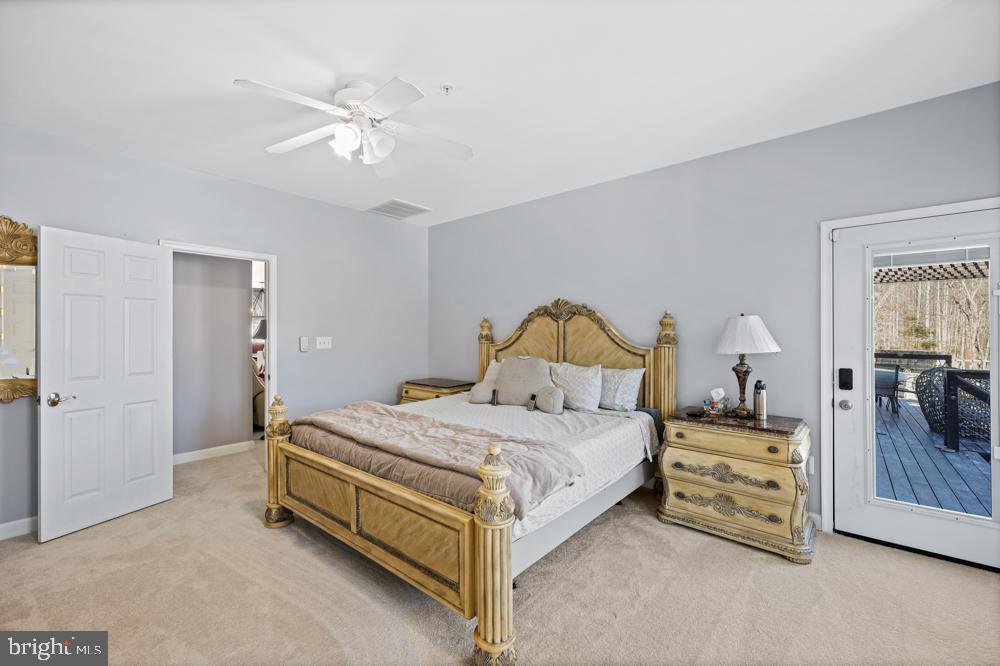 13710 Baden Naylor Road Upper Marlboro, MD 20772 - Photo 25 of 66 a bedroom with a bed and a chandelier