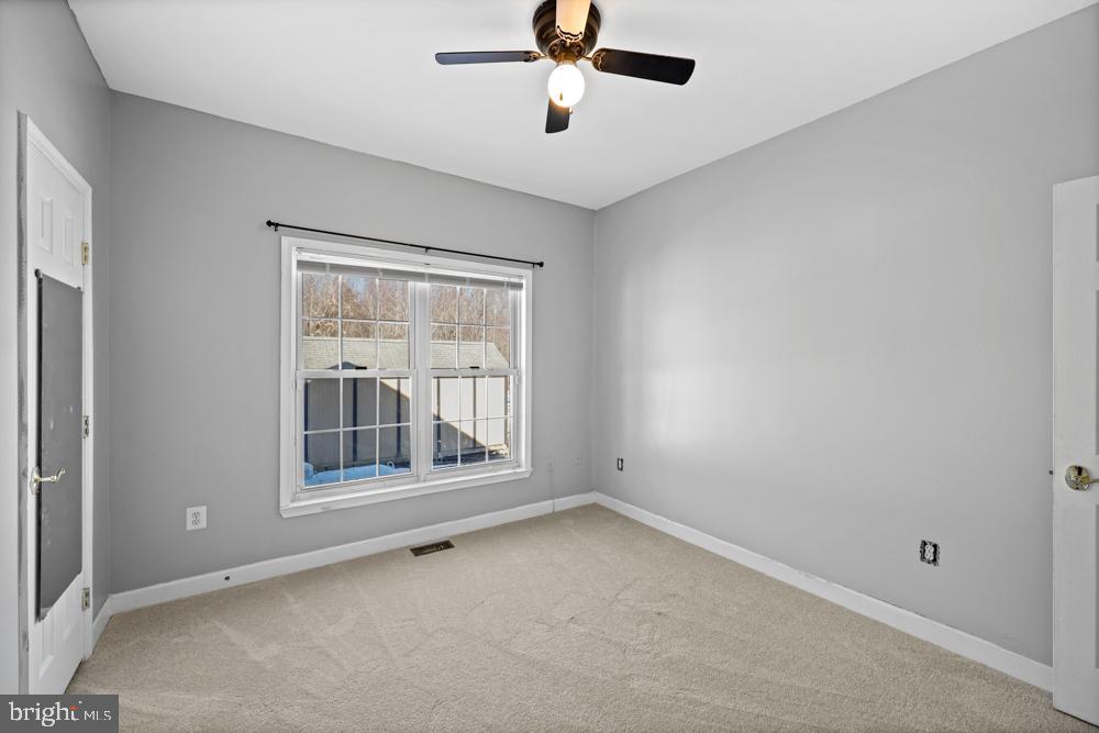 13710 Baden Naylor Road Upper Marlboro, MD 20772 - Photo 36 of 66 an empty room with wooden floor and windows
