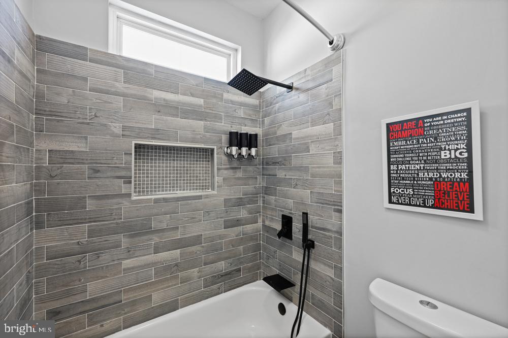 13710 Baden Naylor Road Upper Marlboro, MD 20772 - Photo 39 of 66 a bathroom with a toilet and a shower