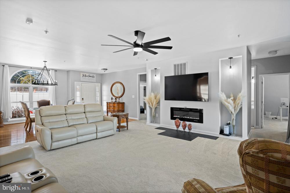 13710 Baden Naylor Road Upper Marlboro, MD 20772 - Photo 7 of 66 a living room with furniture and a flat screen tv