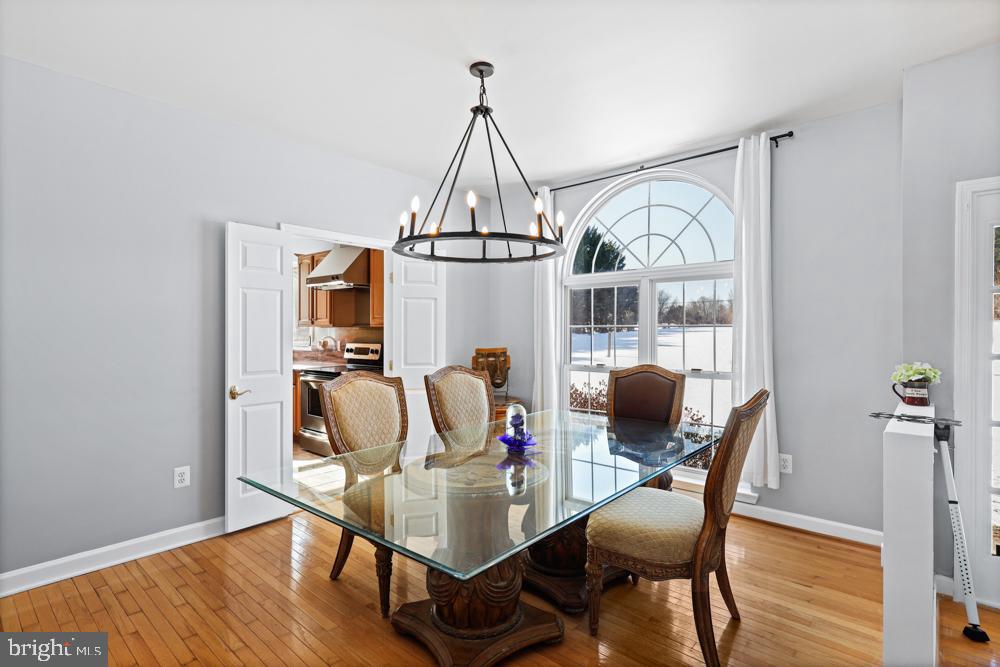 13710 Baden Naylor Road Upper Marlboro, MD 20772 - Photo 10 of 66 a view of a dining room with furniture window and wooden floor