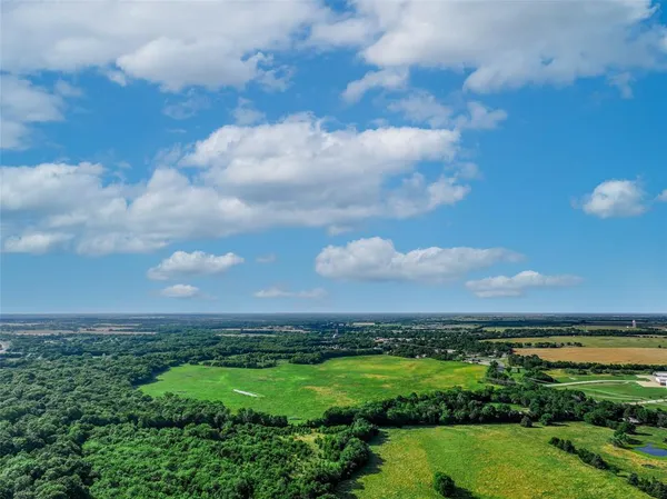 a view of a city with lots of green space
