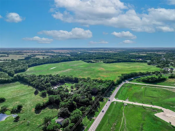 a view of a golf course with a big yard