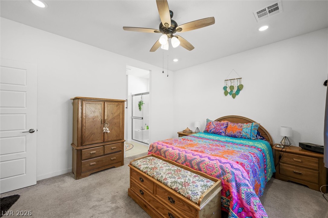 4743 South Springridge Street Pahrump, NV 89061 - Photo 25 of 50 Bedroom featuring a ceiling fan, recessed lighting, and carpet