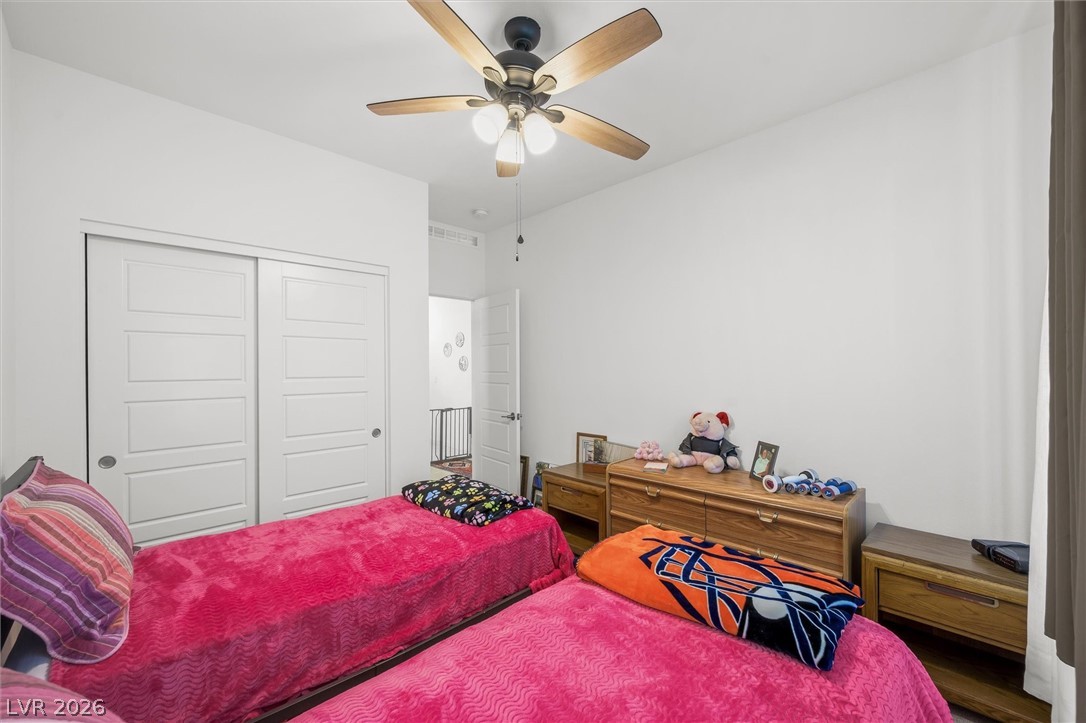 4743 South Springridge Street Pahrump, NV 89061 - Photo 29 of 50 Carpeted bedroom featuring a closet and a ceiling fan