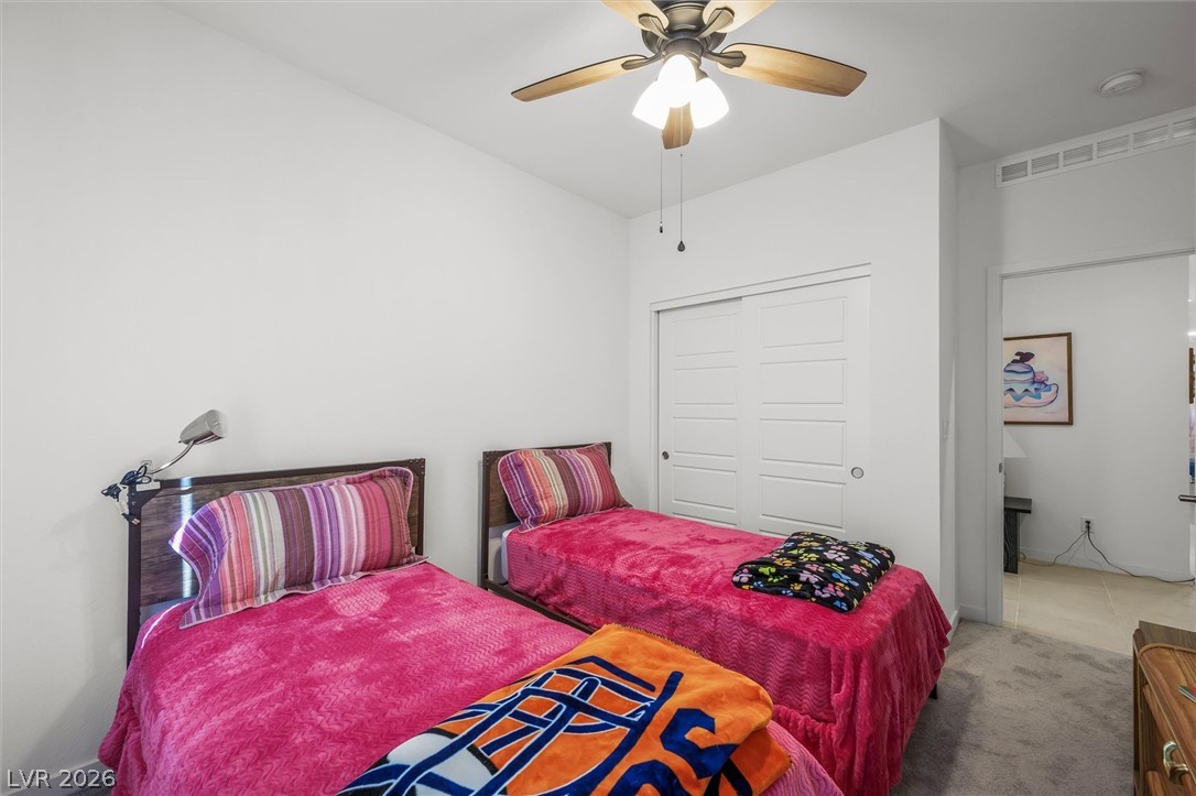 4743 South Springridge Street Pahrump, NV 89061 - Photo 30 of 50 Bedroom with dark colored carpet and a ceiling fan