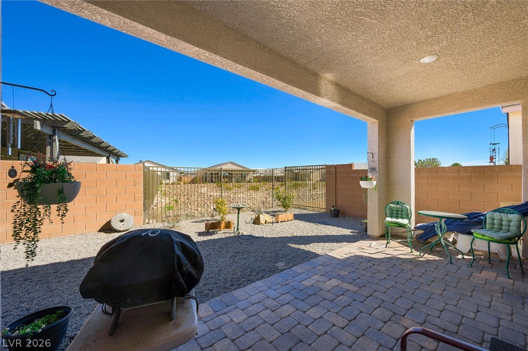 4743 South Springridge Street Pahrump, NV 89061 - Photo 34 of 50 Fenced backyard with a patio area