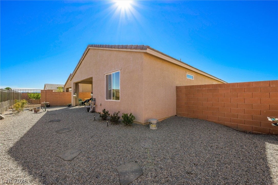 4743 South Springridge Street Pahrump, NV 89061 - Photo 36 of 50 Fenced backyard featuring a patio area