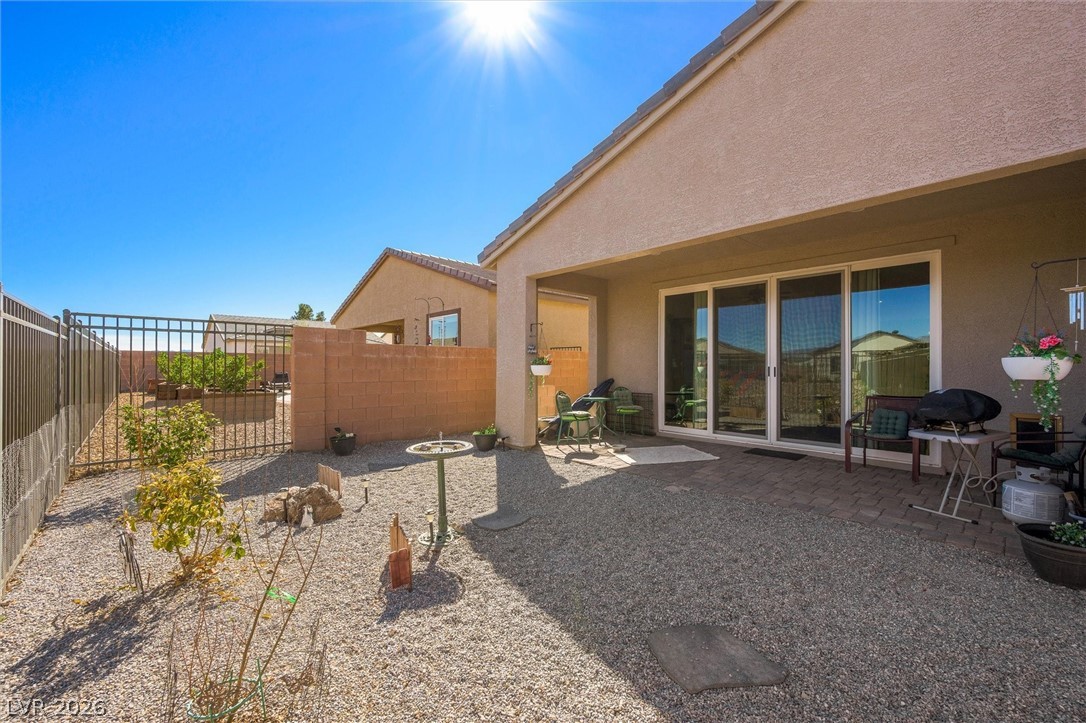4743 South Springridge Street Pahrump, NV 89061 - Photo 37 of 50 View of side of home featuring stucco siding and a fenced backyard
