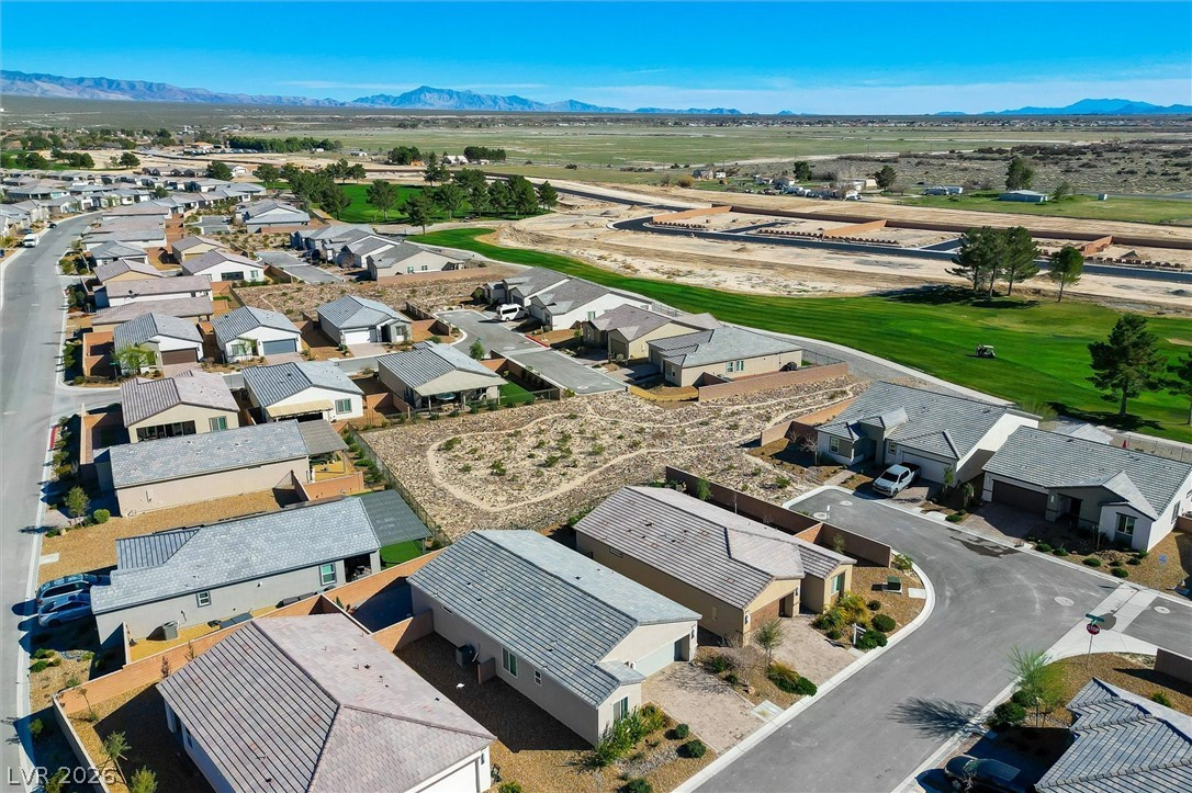 4743 South Springridge Street Pahrump, NV 89061 - Photo 4 of 50 Aerial view of residential area featuring a mountain backdrop